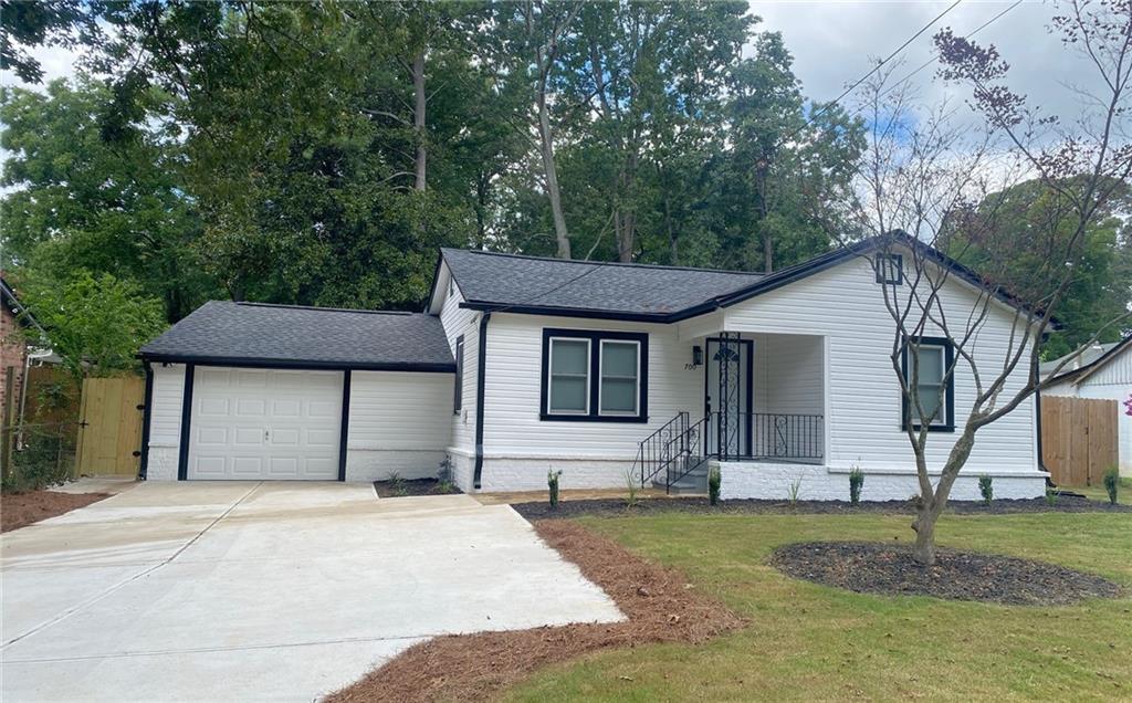 a house that has a tree in front of it