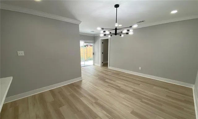 a view of a livingroom with a chandelier fan