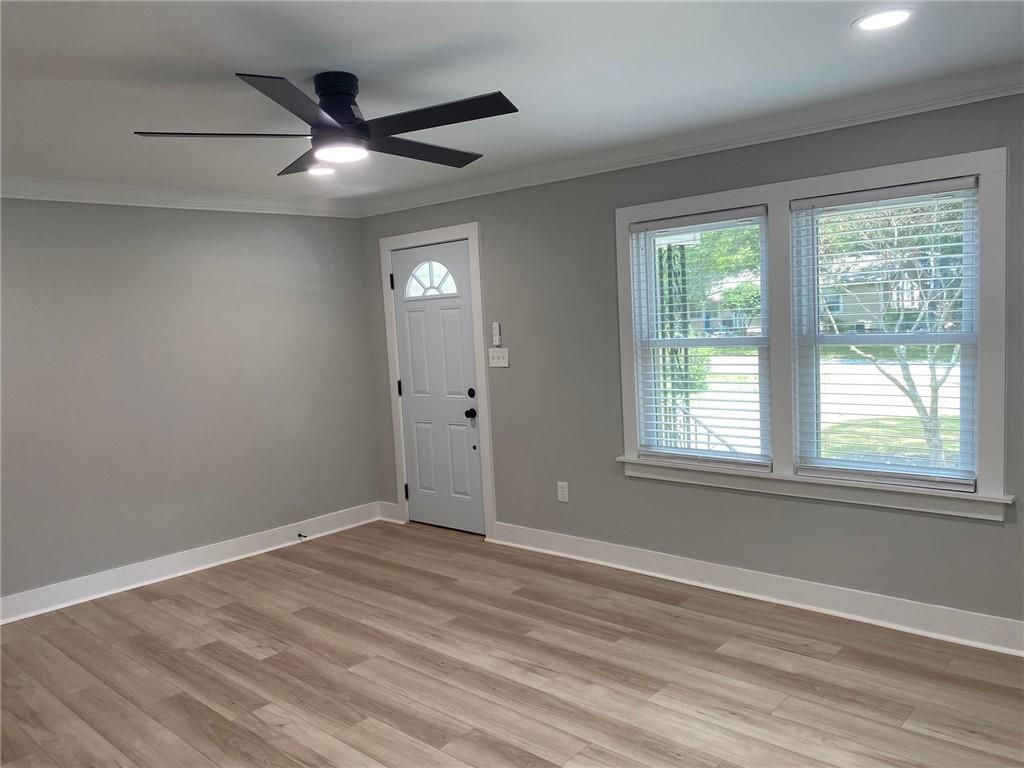 700 Appleton Drive Southeast Marietta, GA 30008 - Photo 19 of 52 a view of an empty room with wooden floor and a window