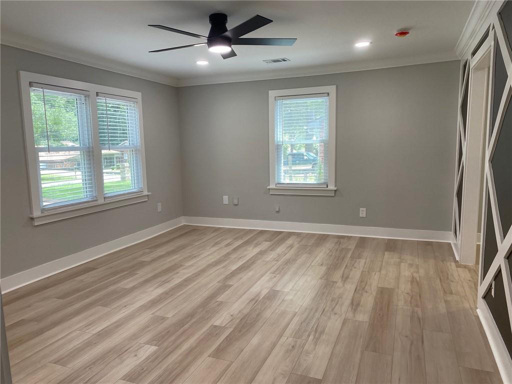 700 Appleton Drive Southeast Marietta, GA 30008 - Photo 20 of 52 a view of an empty room with wooden floor and a window