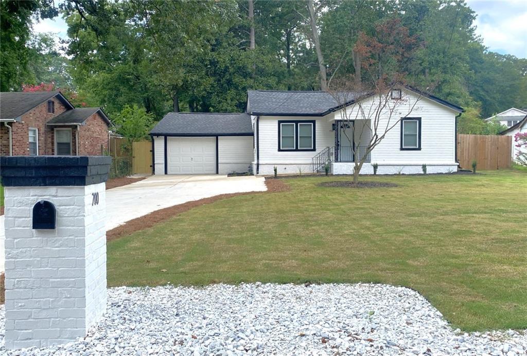 700 Appleton Drive Southeast Marietta, GA 30008 - Photo 2 of 52 a front view of a house with a yard