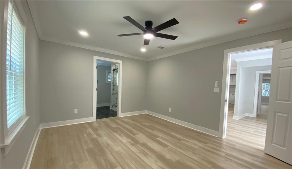 700 Appleton Drive Southeast Marietta, GA 30008 - Photo 22 of 52 an empty room with wooden floor and windows
