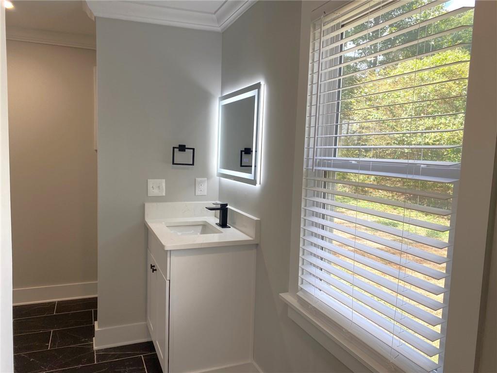 700 Appleton Drive Southeast Marietta, GA 30008 - Photo 32 of 52 a bathroom with a sink and a window