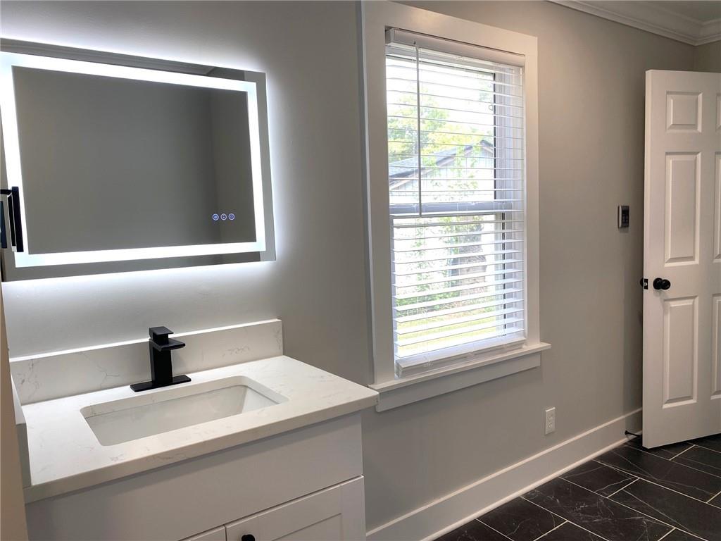 700 Appleton Drive Southeast Marietta, GA 30008 - Photo 33 of 52 a bathroom with a sink and a mirror