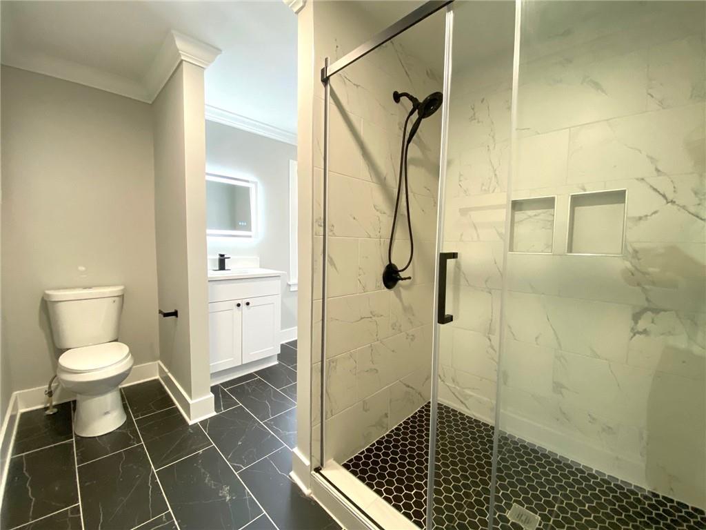 700 Appleton Drive Southeast Marietta, GA 30008 - Photo 34 of 52 a bathroom with a toilet and a shower