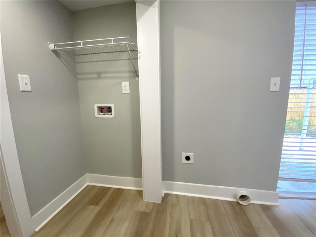 700 Appleton Drive Southeast Marietta, GA 30008 - Photo 43 of 52 a view of a room with wooden floor and a window