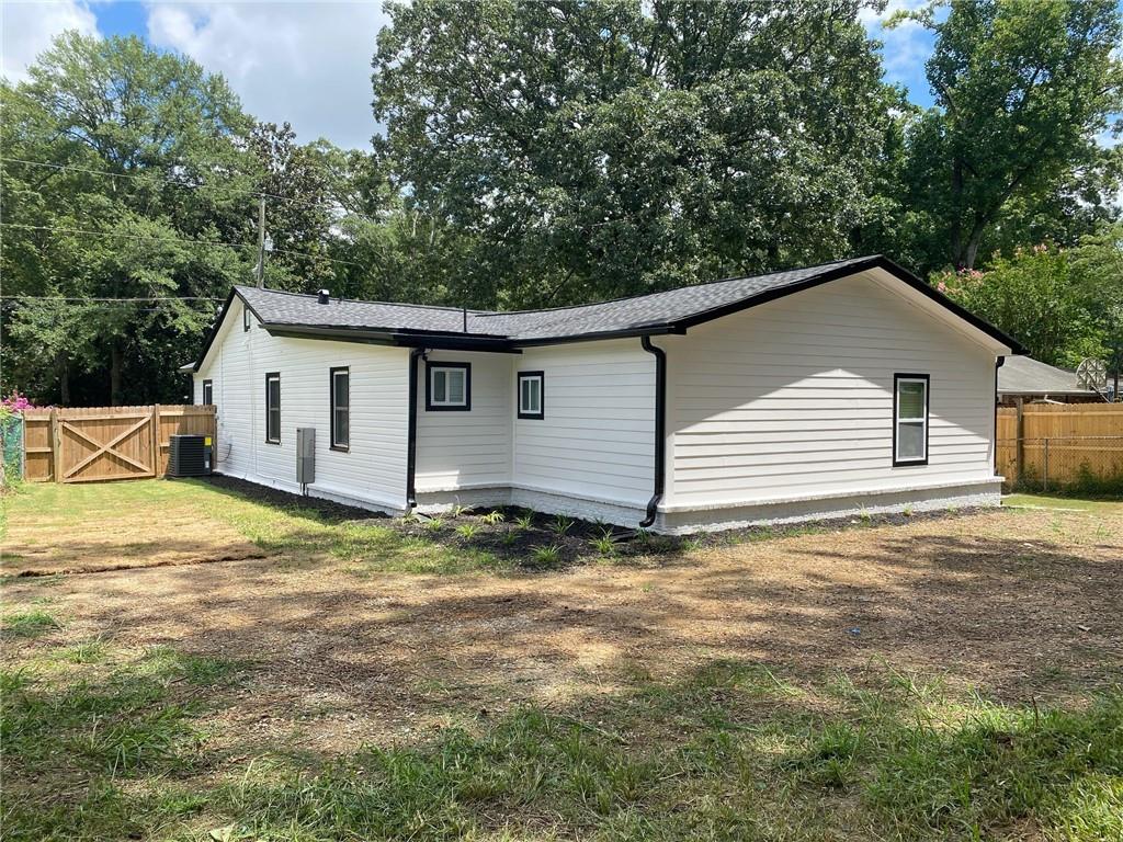 700 Appleton Drive Southeast Marietta, GA 30008 - Photo 46 of 52 a view of a house with backyard and trees in the background