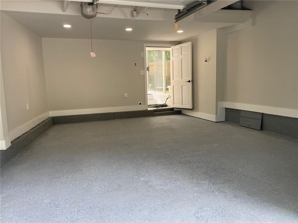 700 Appleton Drive Southeast Marietta, GA 30008 - Photo 48 of 52 an empty room with wooden floor and windows