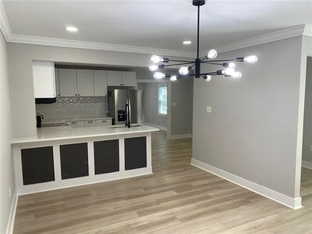 a view of a kitchen with a sink and dishwasher