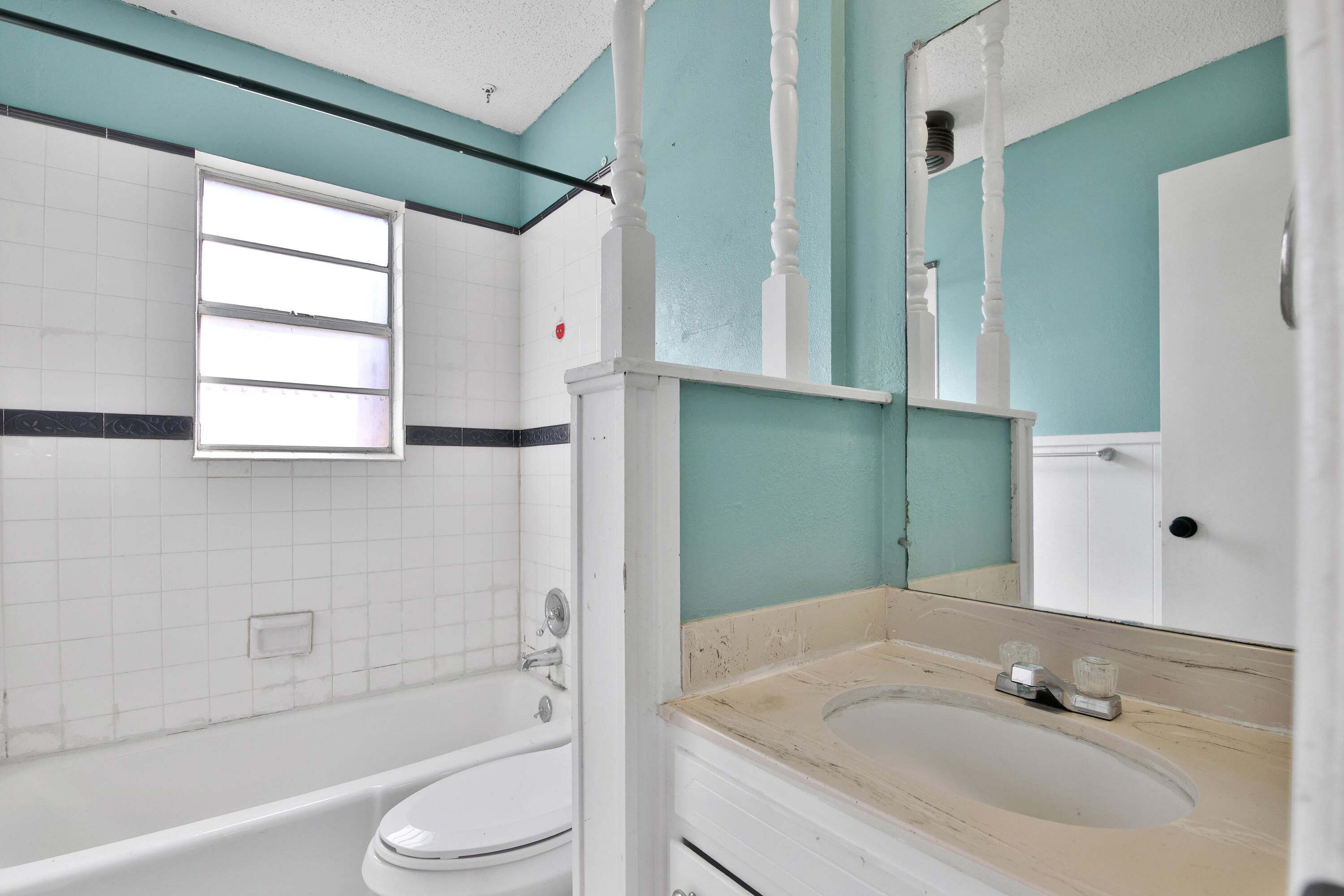 6607 Avenue U Lubbock, TX 79412 - Photo 22 of 25 a bathroom with a sink toilet and shower