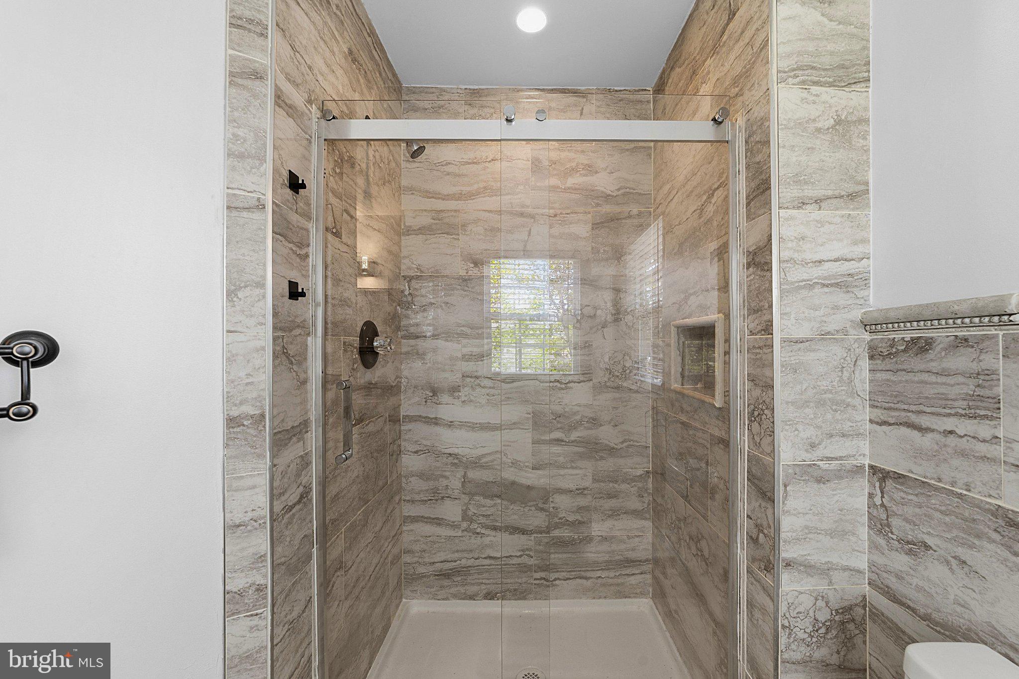 683 South Blue Bell Road Vineland, NJ 08360 - Photo 19 of 38 Sleek modern shower with elegant tiles.