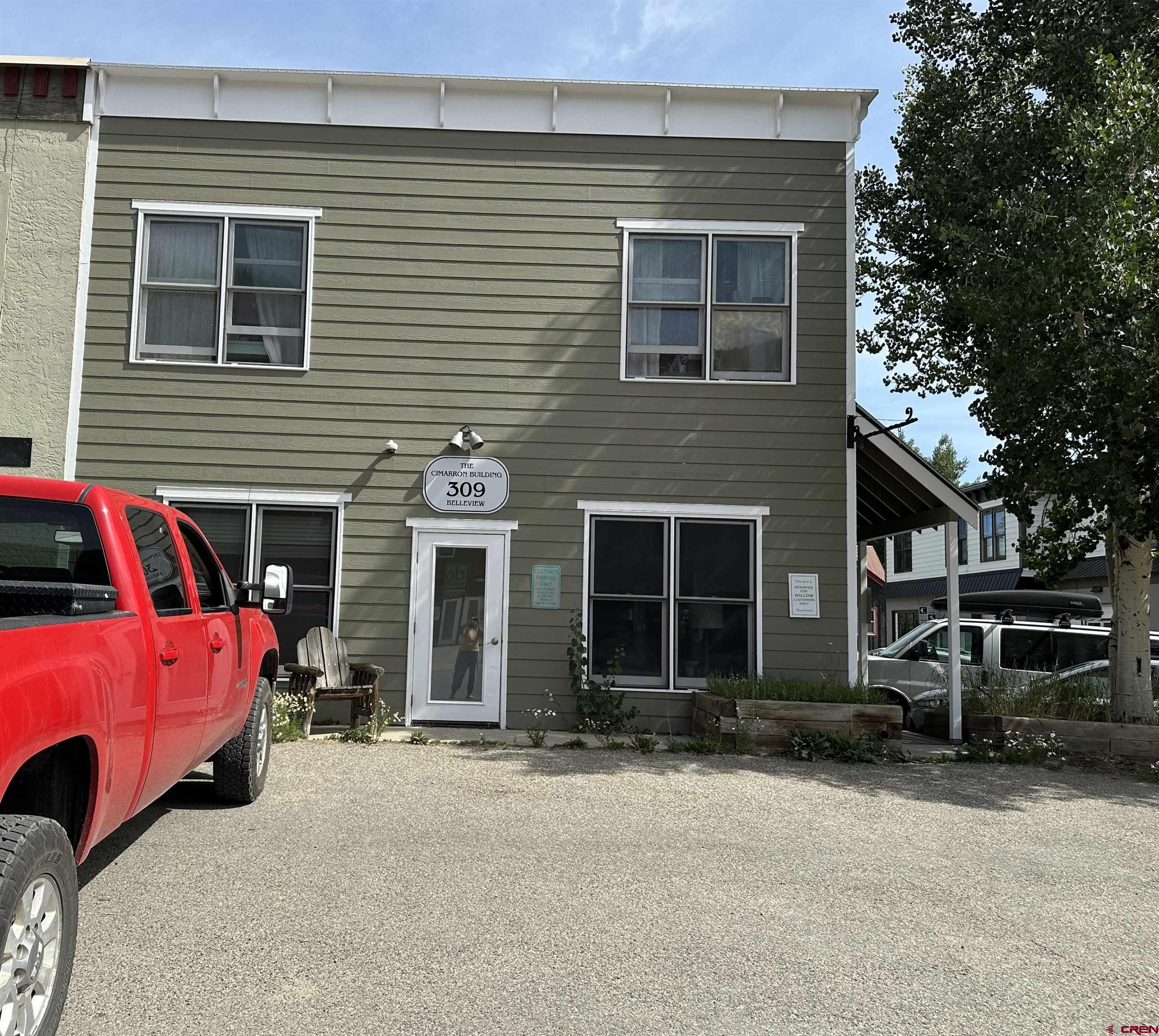 309 Belleview Avenue, Unit 2A Crested Butte, CO 81224 - Photo 1 of 22 a front view of a house with parking space