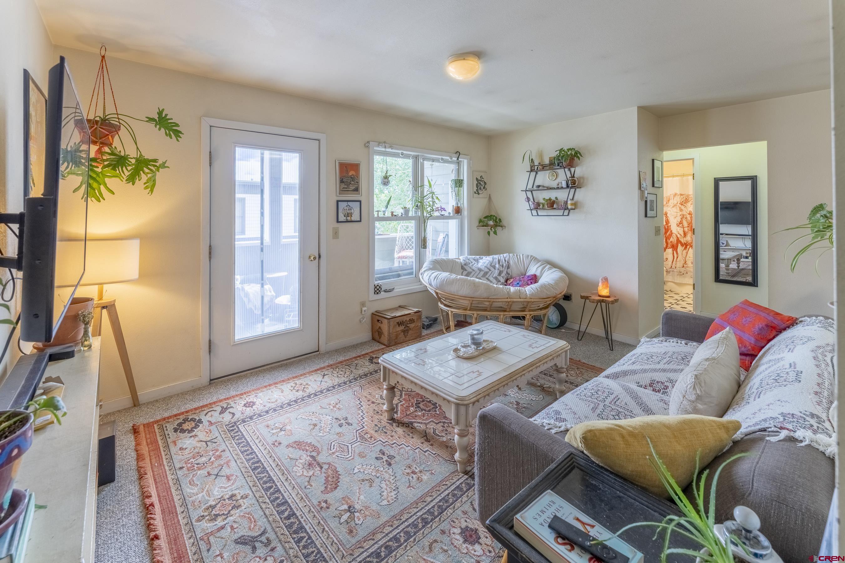 309 Belleview Avenue, Unit 2A Crested Butte, CO 81224 - Photo 18 of 22 a living room with furniture and a window