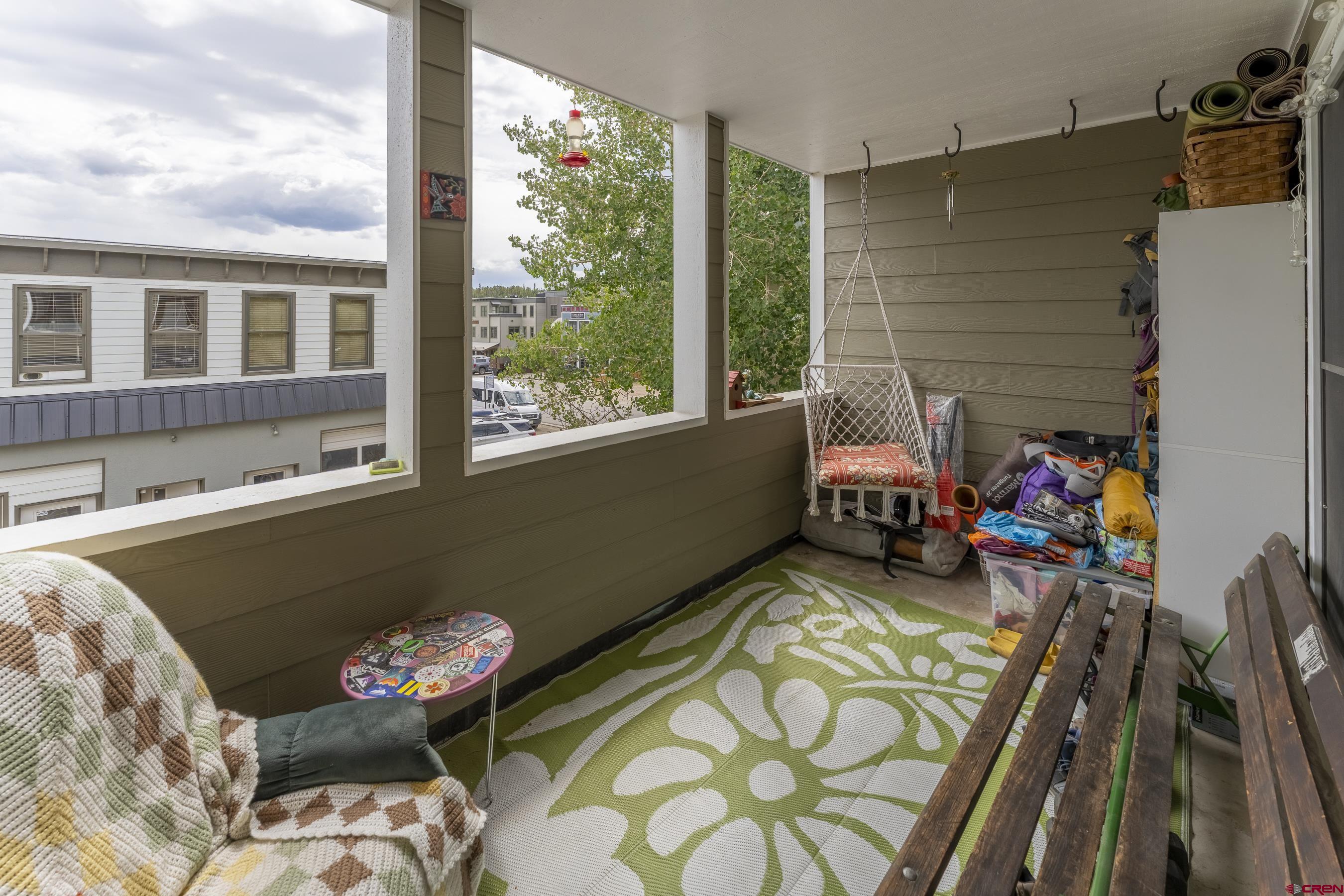 309 Belleview Avenue, Unit 2A Crested Butte, CO 81224 - Photo 6 of 22 a living room filled with furniture and a large window