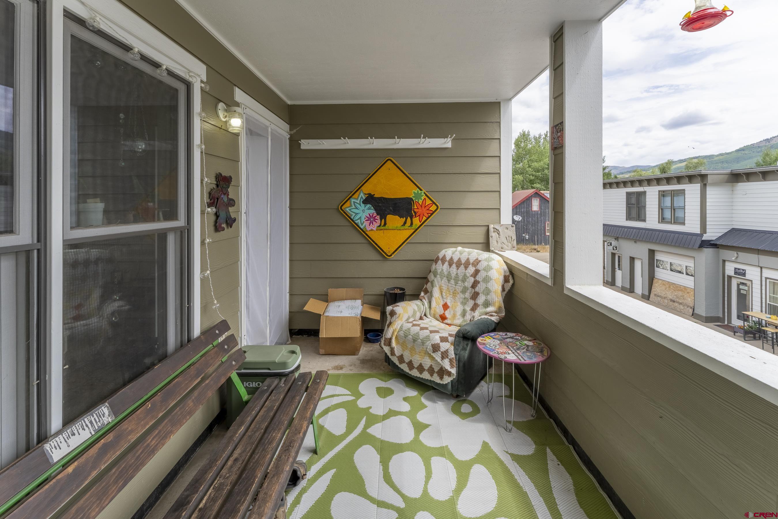 309 Belleview Avenue, Unit 2A Crested Butte, CO 81224 - Photo 8 of 22 a front view of a house with outdoor seating