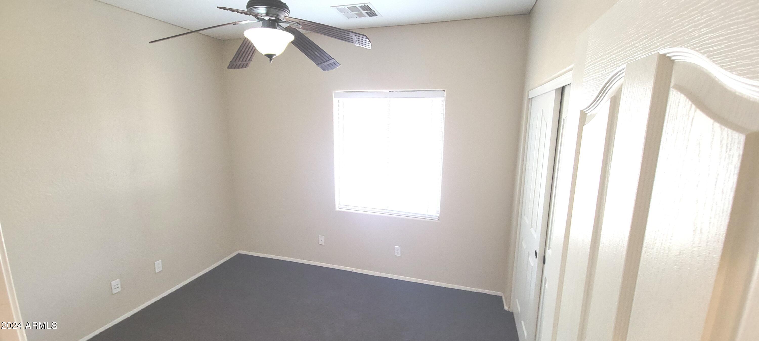 11537 East Sebring Avenue Mesa, AZ 85212 - Photo 17 of 24 a view of an empty room with a window