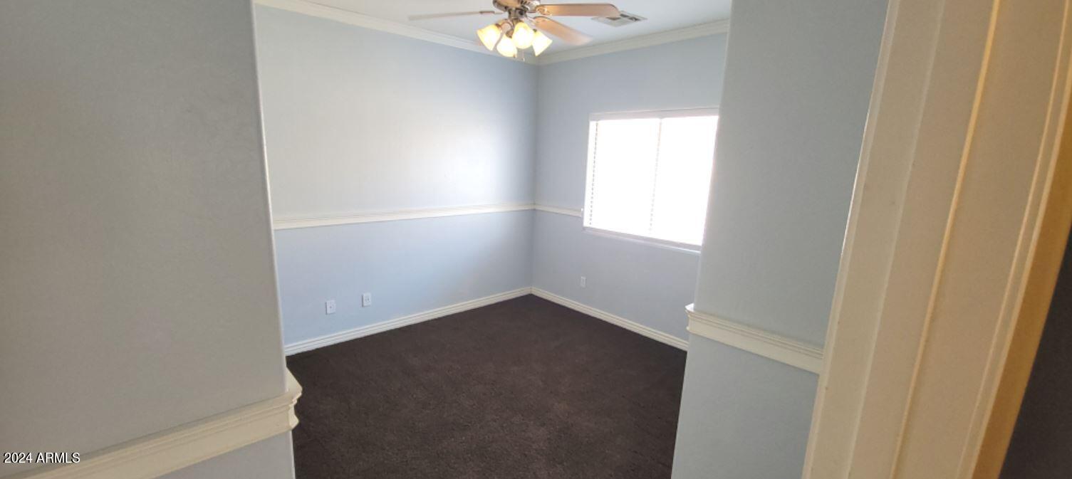 11537 East Sebring Avenue Mesa, AZ 85212 - Photo 18 of 24 an empty room with windows and chandelier fan