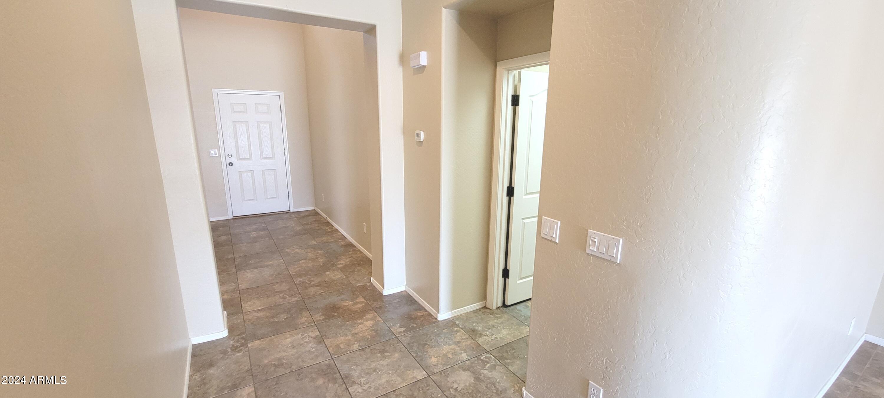 11537 East Sebring Avenue Mesa, AZ 85212 - Photo 9 of 24 a view of a hallway with wooden floor