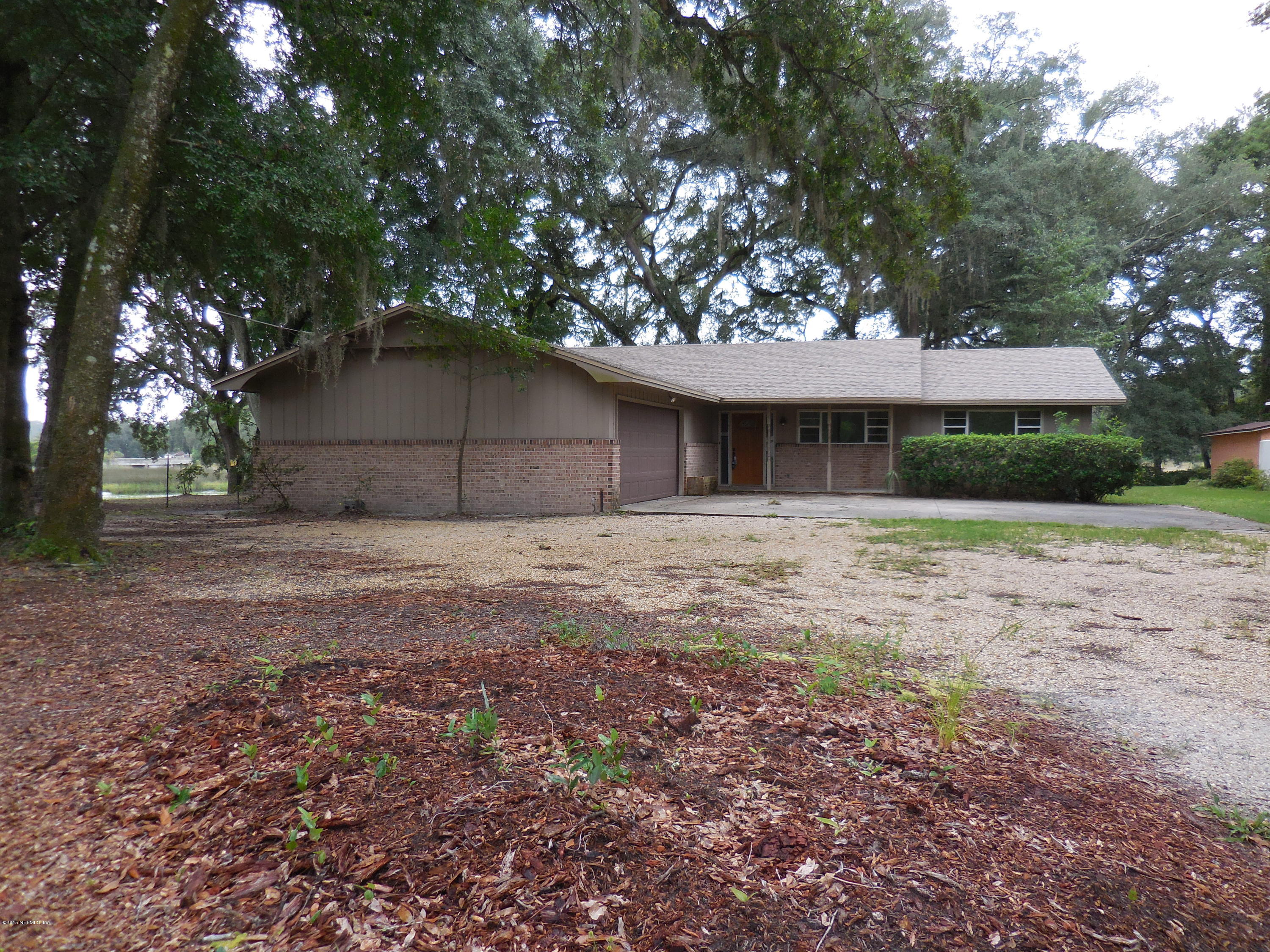 10402 Tulsa Road Jacksonville, FL 32218 - Photo 1 of 34 a house with yard in front of it
