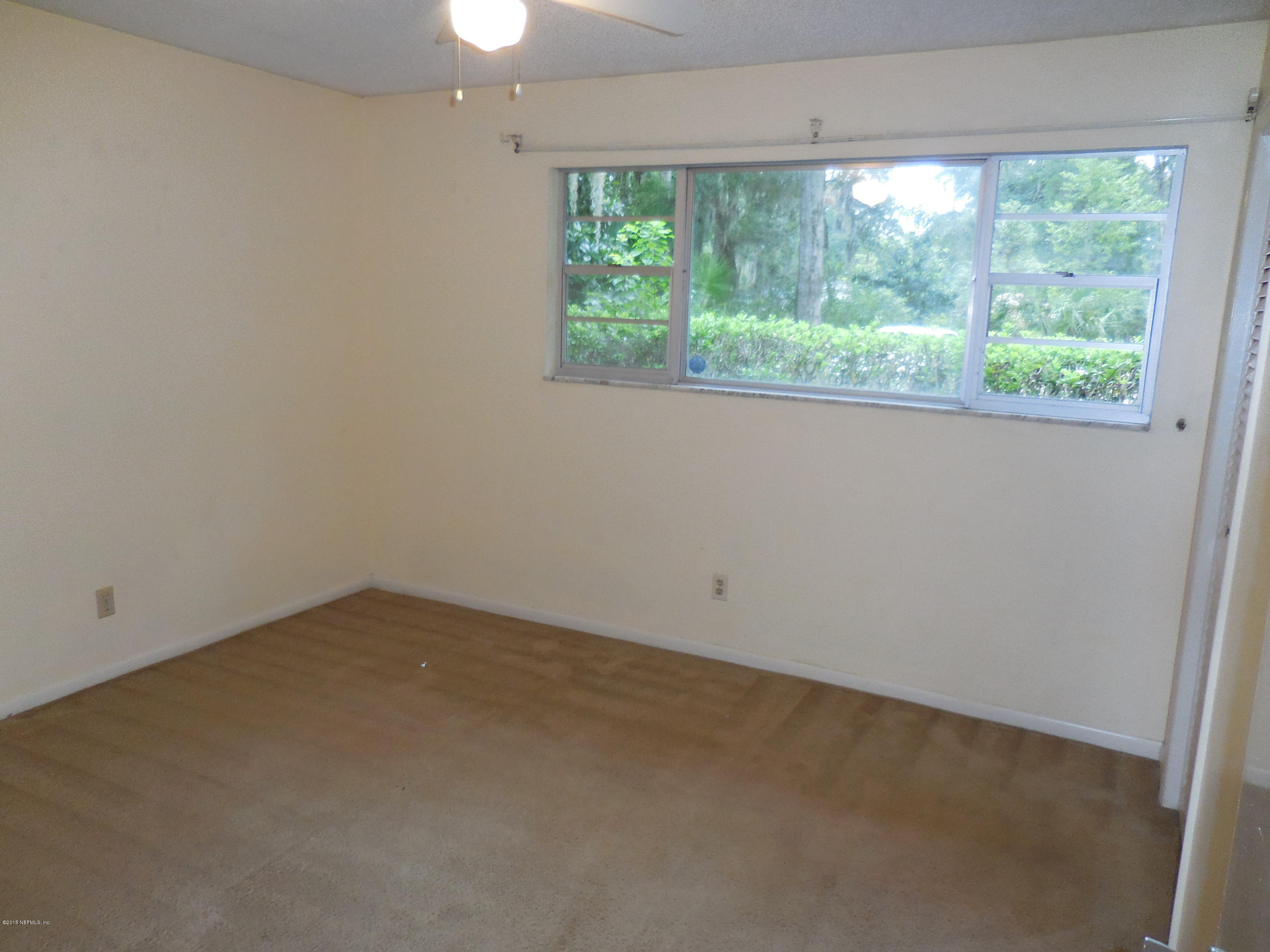 10402 Tulsa Road Jacksonville, FL 32218 - Photo 21 of 34 an empty room with a window