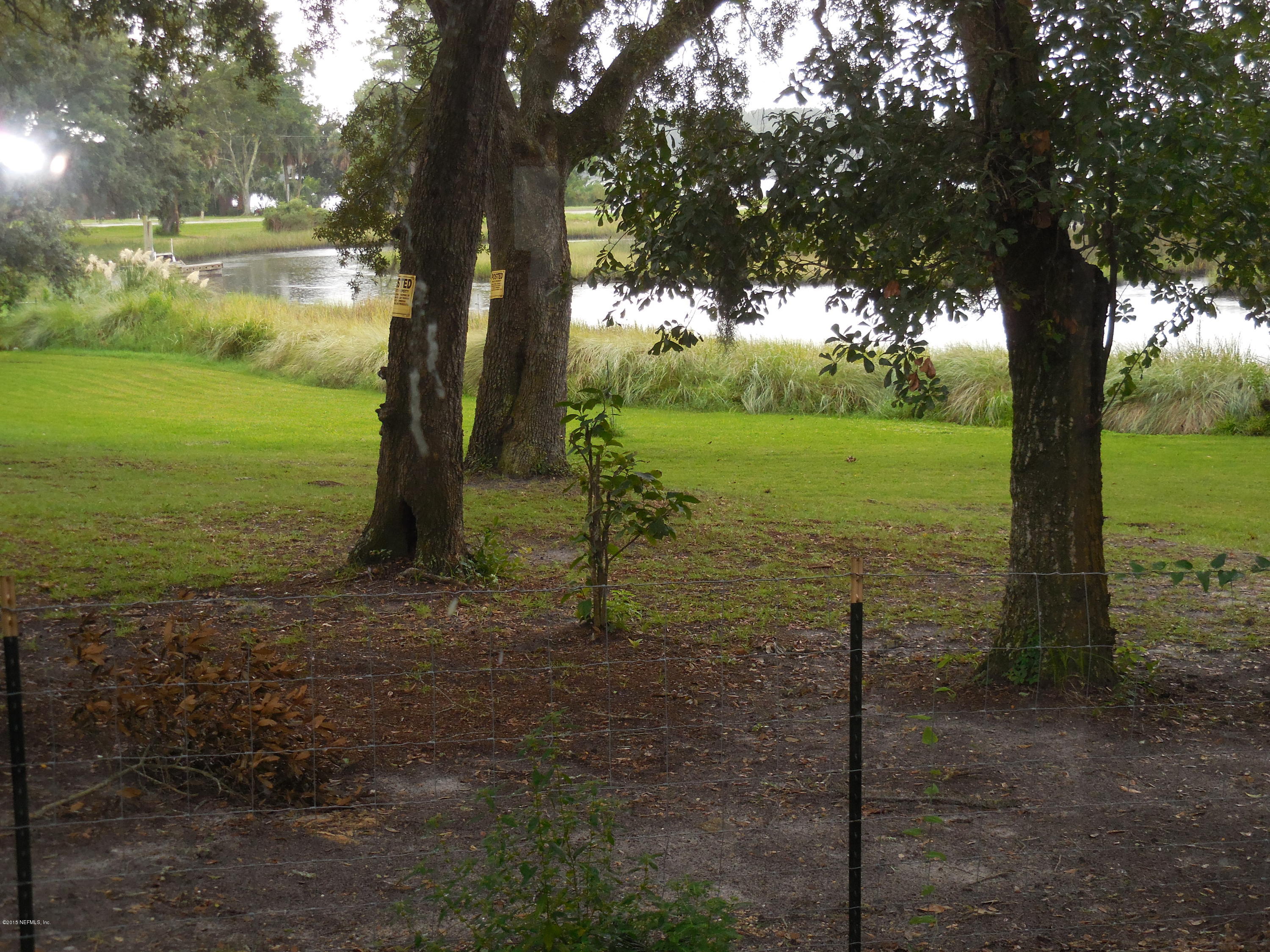10402 Tulsa Road Jacksonville, FL 32218 - Photo 27 of 34 a view of a garden with a tree