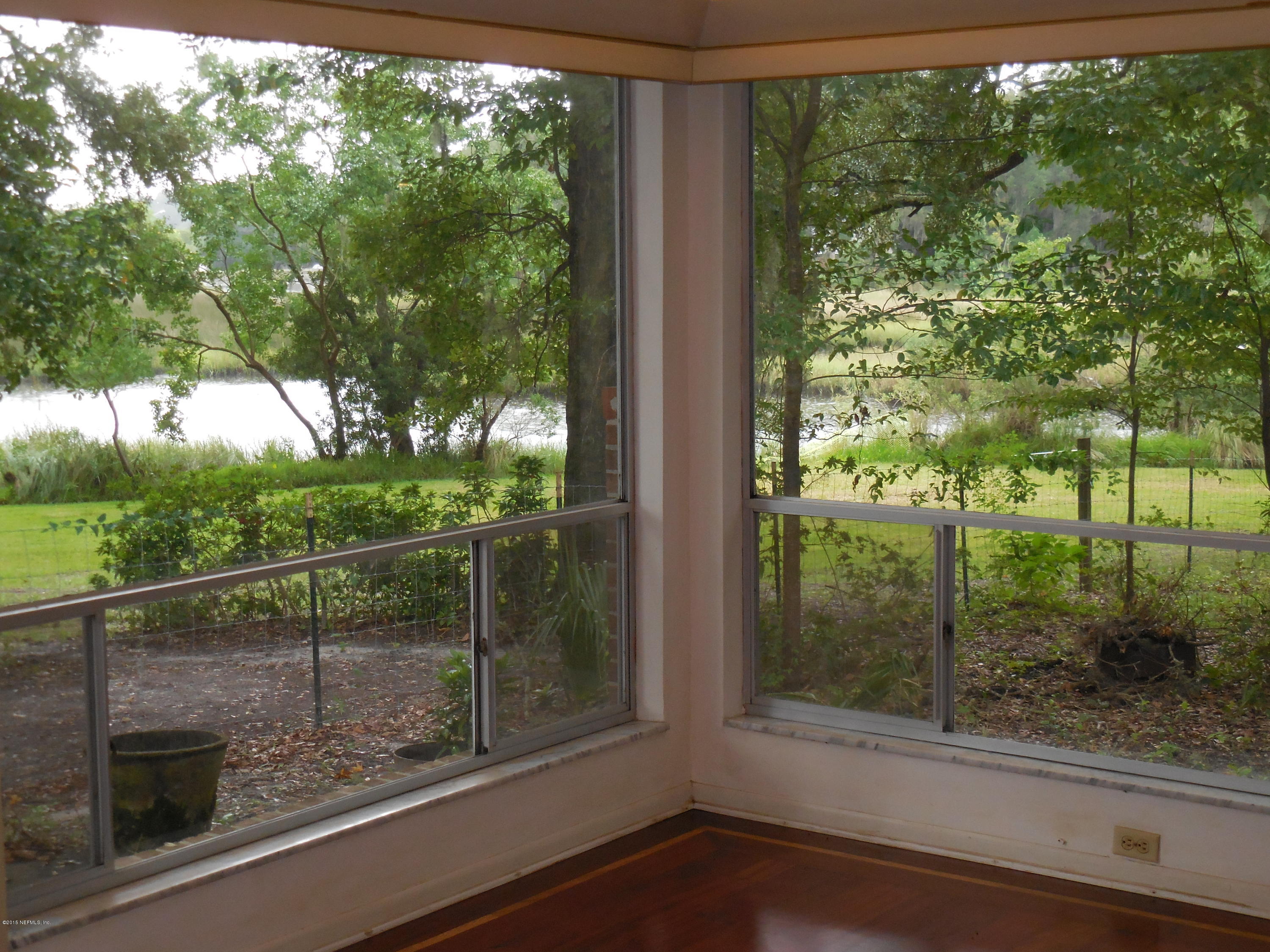 10402 Tulsa Road Jacksonville, FL 32218 - Photo 10 of 34 a view of a glass door and a window