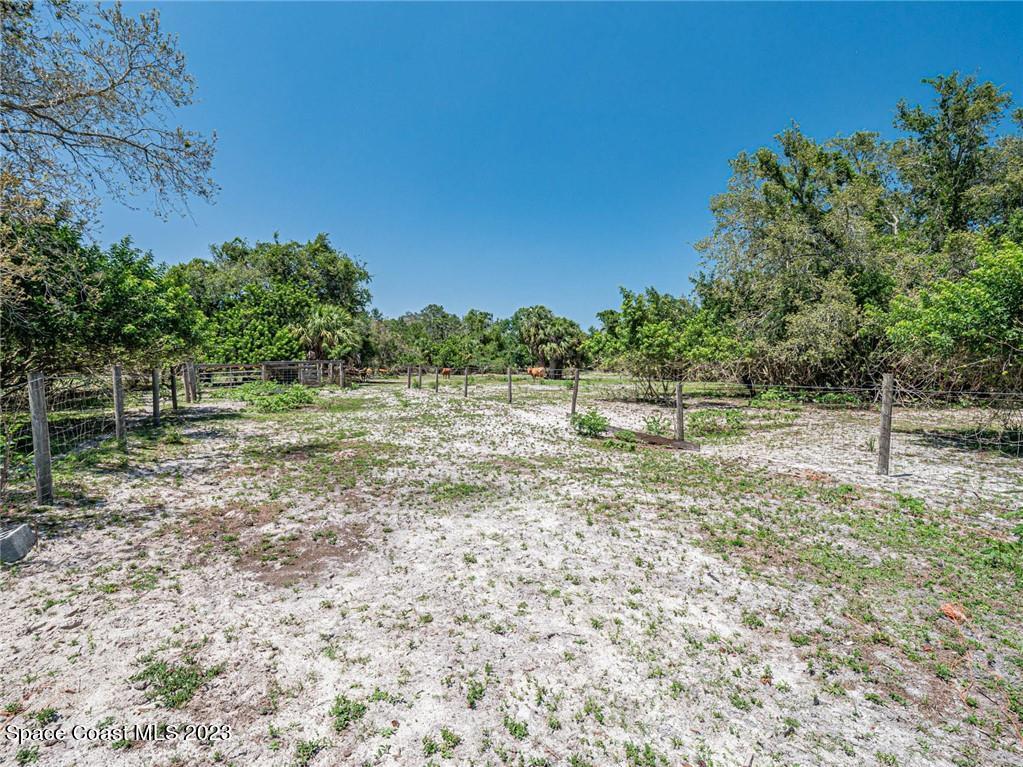 10995 Roseland Road Sebastian, FL 32958 - Photo 11 of 35 a view of a green field with trees in the background