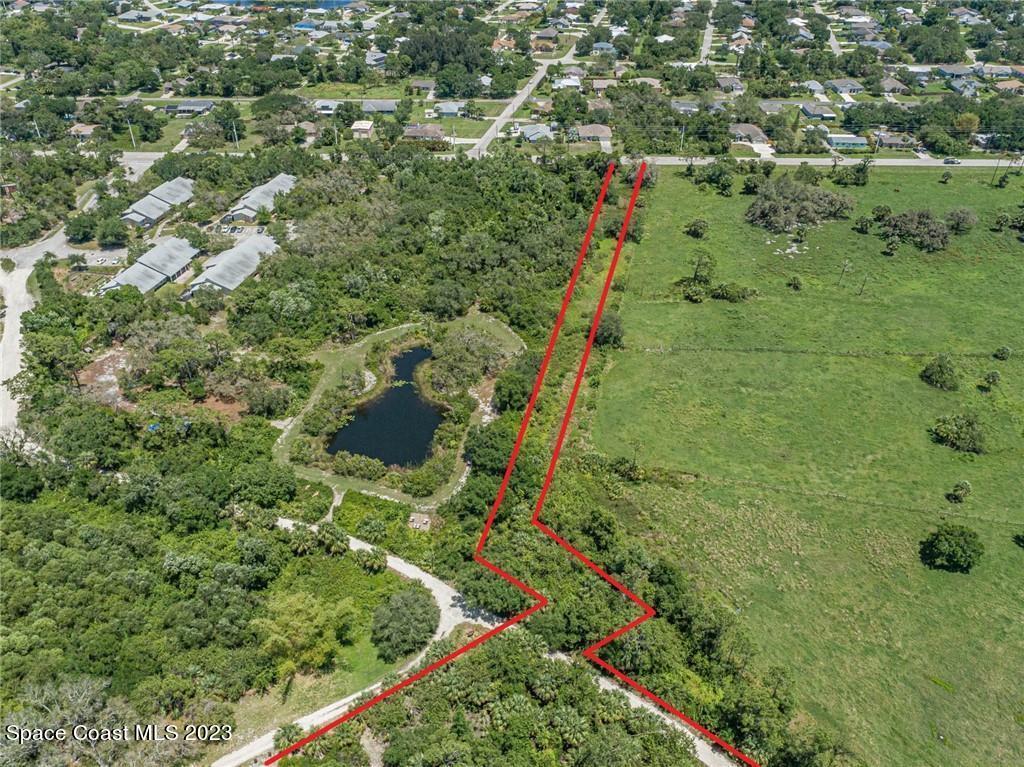 10995 Roseland Road Sebastian, FL 32958 - Photo 26 of 35 an aerial view of residential houses with outdoor space