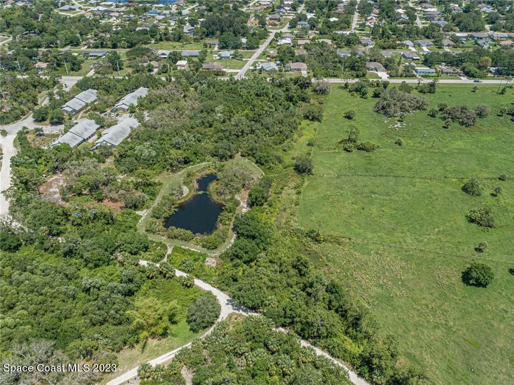 10995 Roseland Road Sebastian, FL 32958 - Photo 29 of 35 an aerial view of residential house with outdoor space and trees all around
