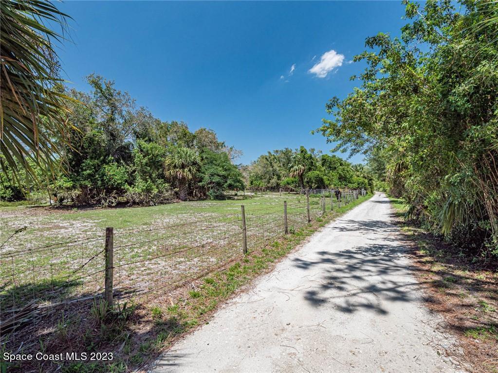 10995 Roseland Road Sebastian, FL 32958 - Photo 7 of 35 a view of a yard with wooden fence