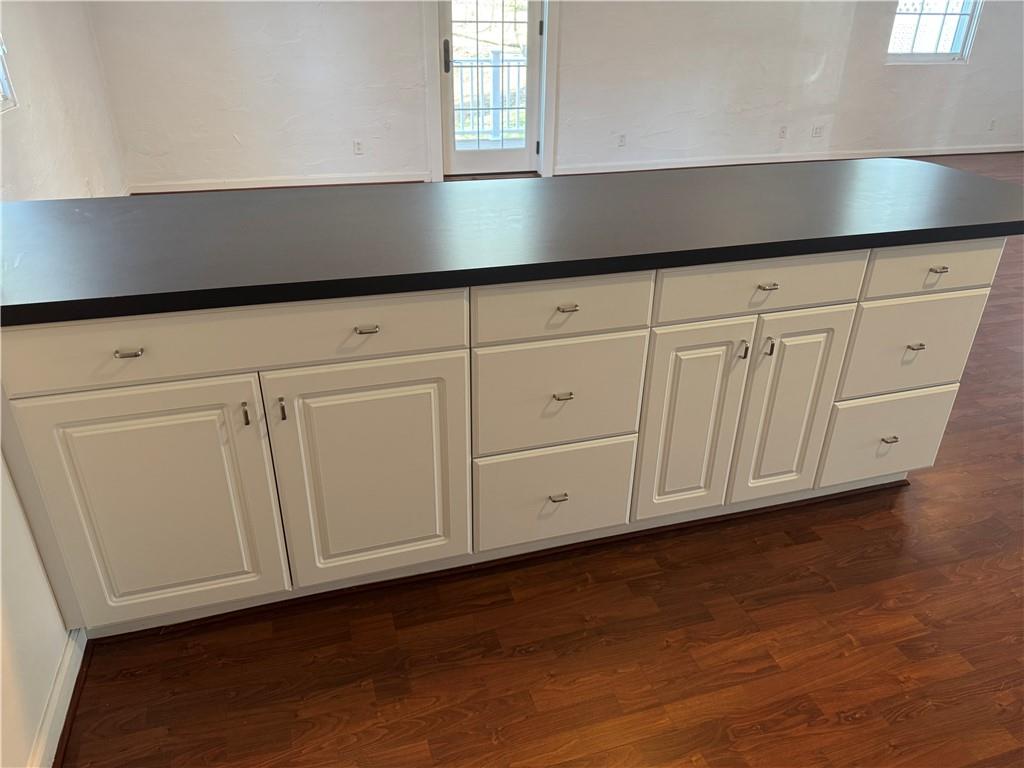 411 Water Works Road Sewickley, PA 15143 - Photo 12 of 36 a kitchen with granite countertop white cabinets and a hard wood floors