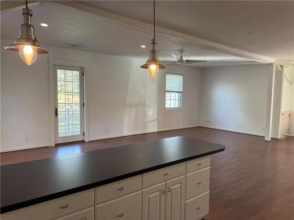 411 Water Works Road Sewickley, PA 15143 - Photo 14 of 36 a kitchen with kitchen island a chandelier stainless steel appliances and a window