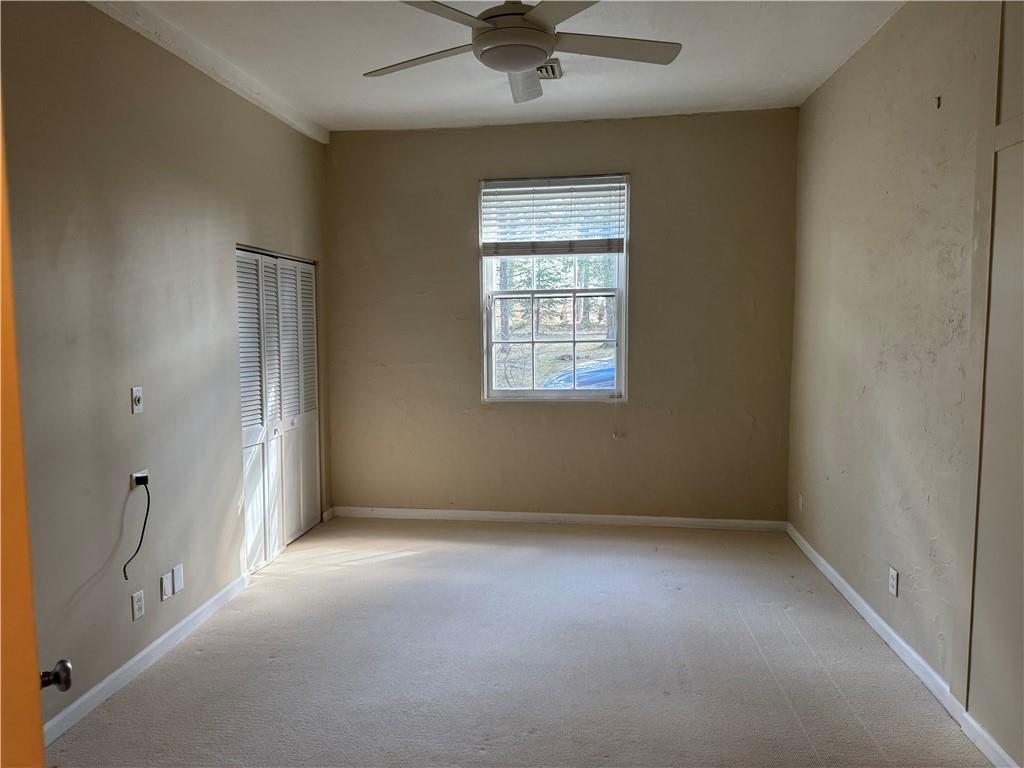411 Water Works Road Sewickley, PA 15143 - Photo 20 of 36 an empty room with a ceiling fan and a window