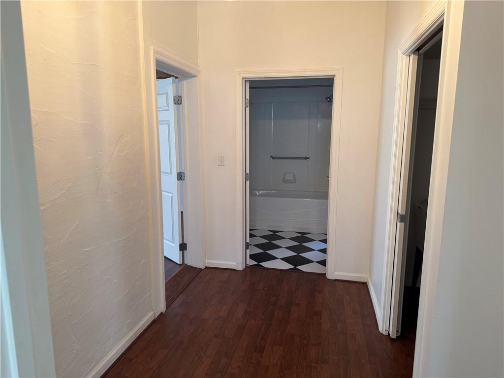 411 Water Works Road Sewickley, PA 15143 - Photo 21 of 36 a view of a hallway with wooden floor and a bathroom