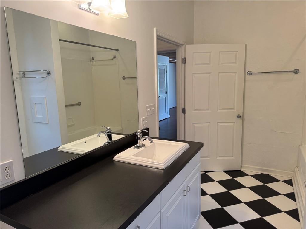 411 Water Works Road Sewickley, PA 15143 - Photo 22 of 36 a bathroom with a double vanity sink and mirror
