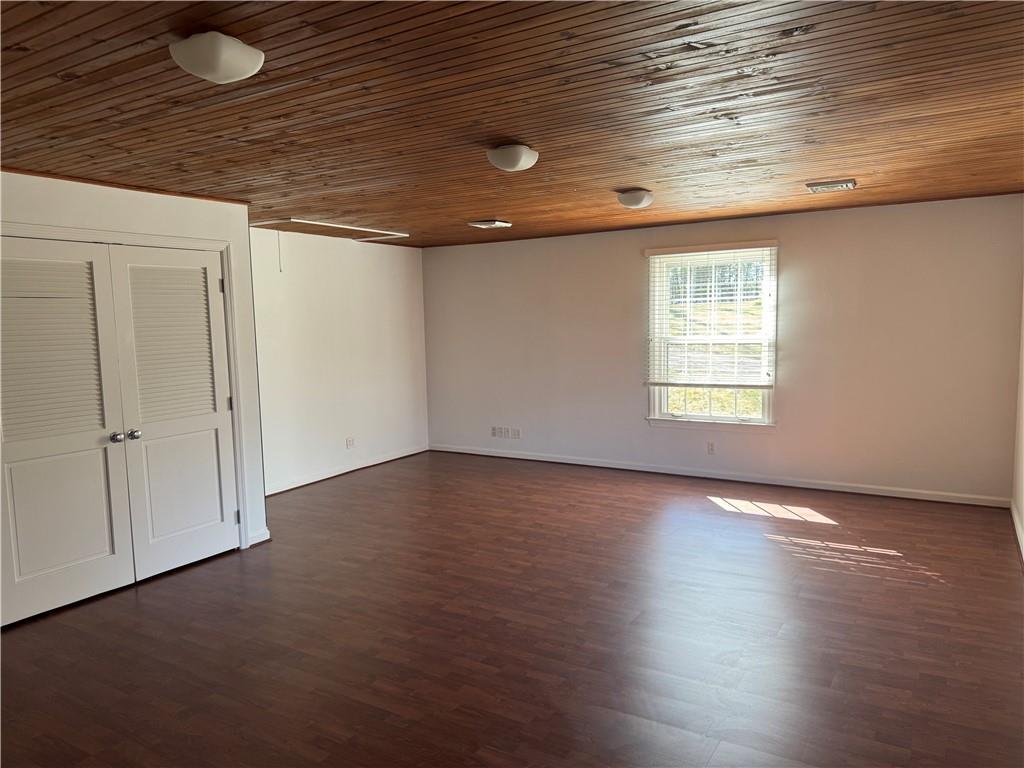 411 Water Works Road Sewickley, PA 15143 - Photo 32 of 36 an empty room with wooden floor and windows