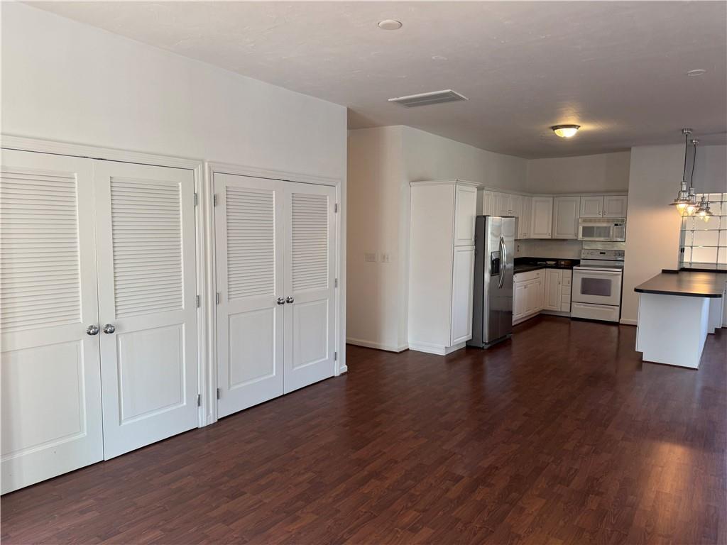411 Water Works Road Sewickley, PA 15143 - Photo 8 of 36 a view of a kitchen with a fridge and wooden floor