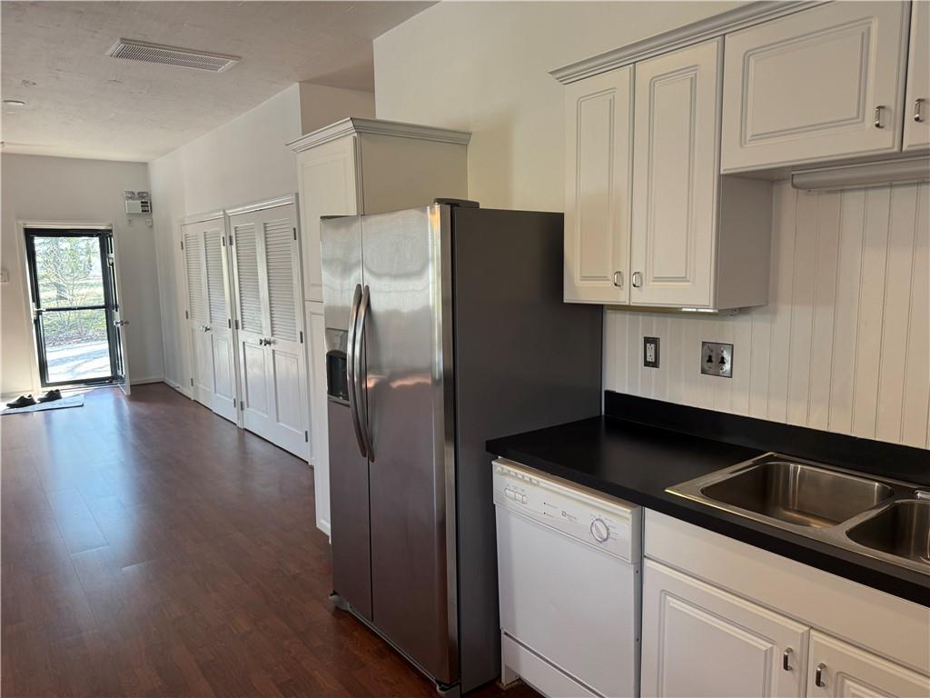 411 Water Works Road Sewickley, PA 15143 - Photo 10 of 36 a kitchen with granite countertop white cabinets and refrigerator