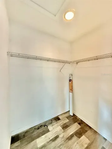 a bathroom with a sink a toilet a mirror and shower