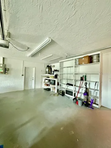 a view of a house with backyard and garden