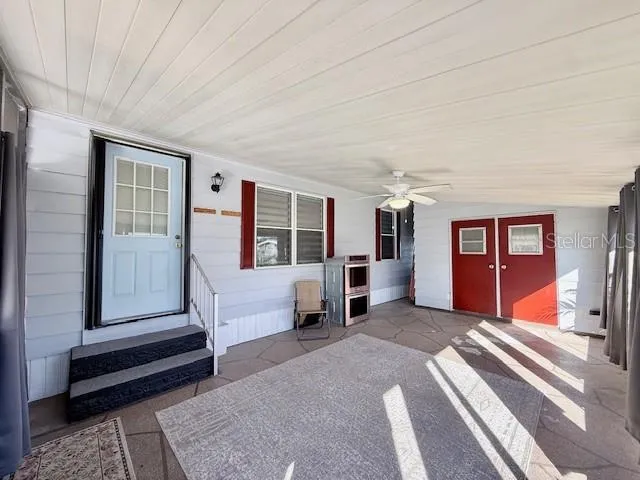 a bedroom with furniture and window