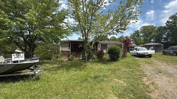 a view of a house with backyard