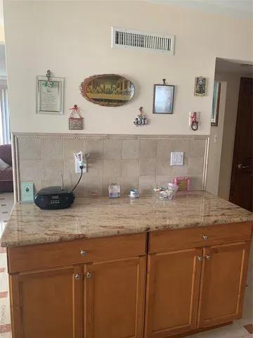 a kitchen with a sink and a stove