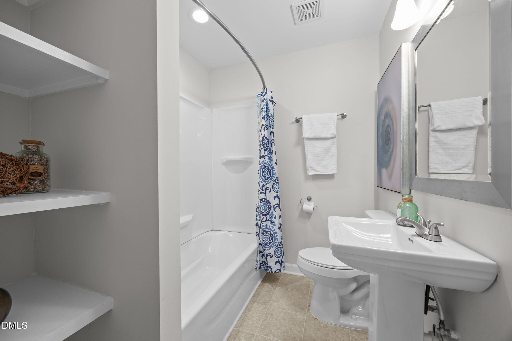 518 Kenway Street Garner, NC 27529 - Photo 3 of 14 a bathroom with a sink toilet and shower