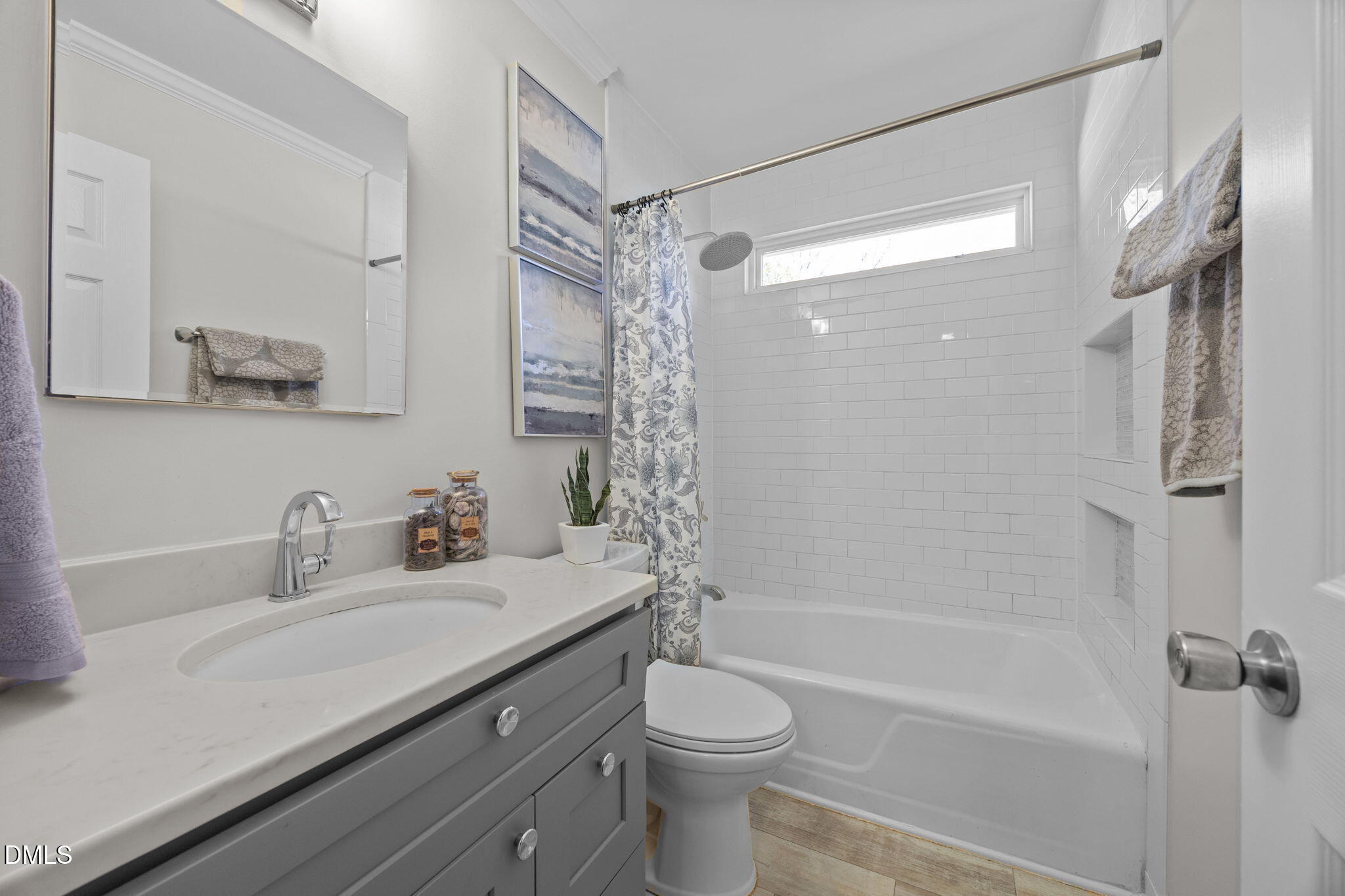 518 Kenway Street Garner, NC 27529 - Photo 9 of 14 a bathroom with a sink a toilet and shower