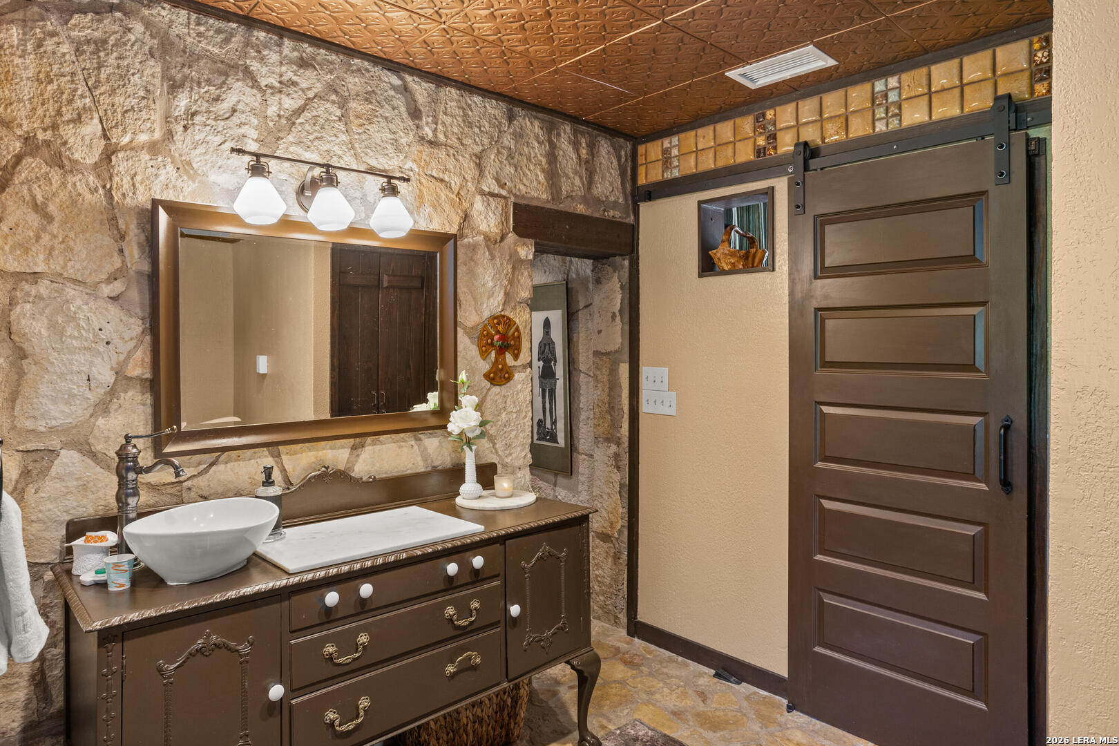 132 Ridge Place Boerne, TX 78006 - Photo 15 of 40 a bathroom with a sink vanity granite and a mirror