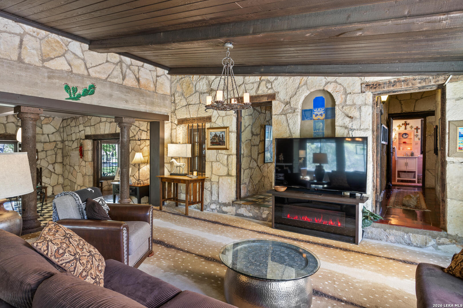 132 Ridge Place Boerne, TX 78006 - Photo 20 of 40 a living room with fireplace furniture and a flat screen tv