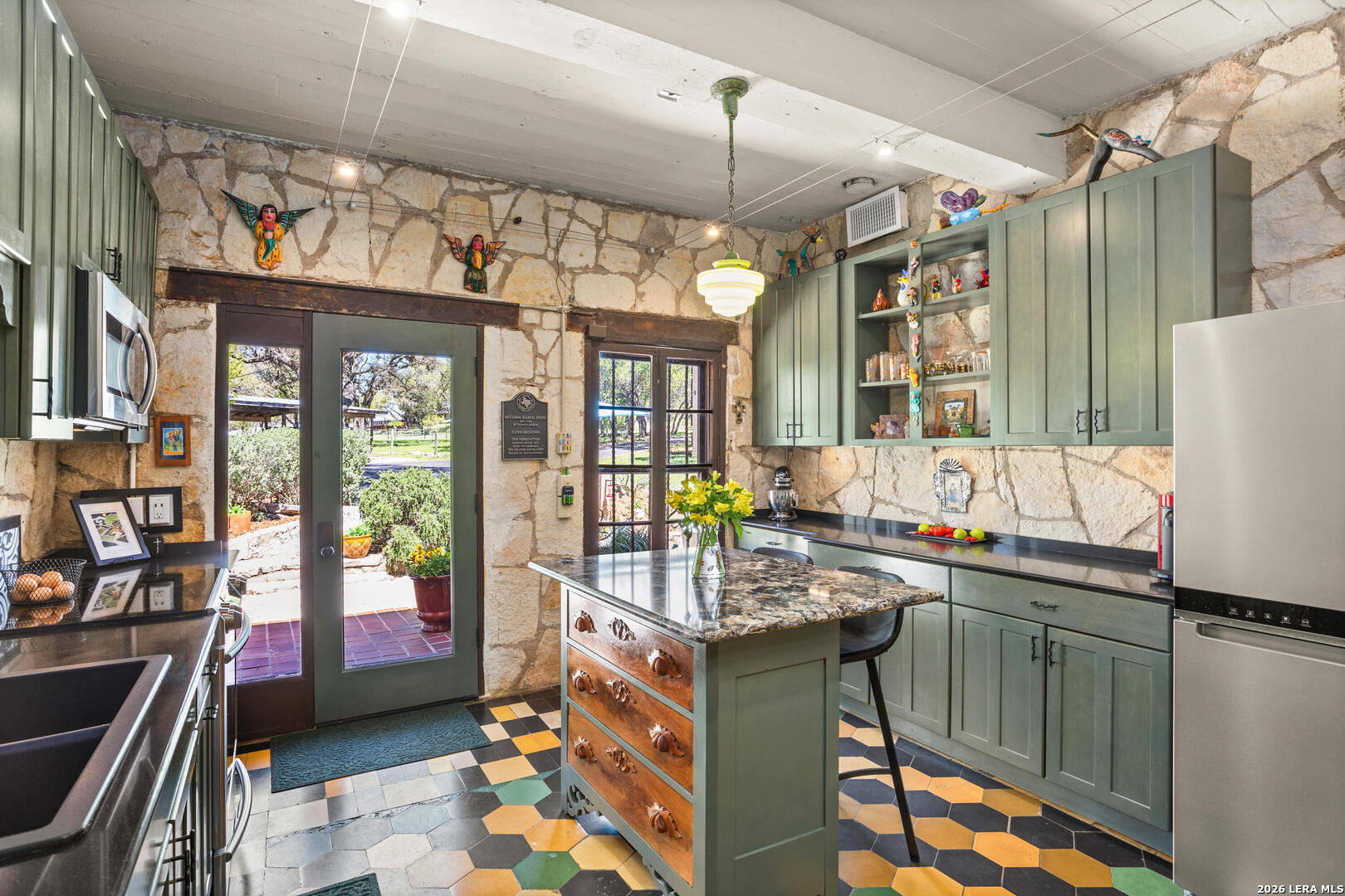 132 Ridge Place Boerne, TX 78006 - Photo 22 of 40 a kitchen with stainless steel appliances granite countertop a sink and cabinets
