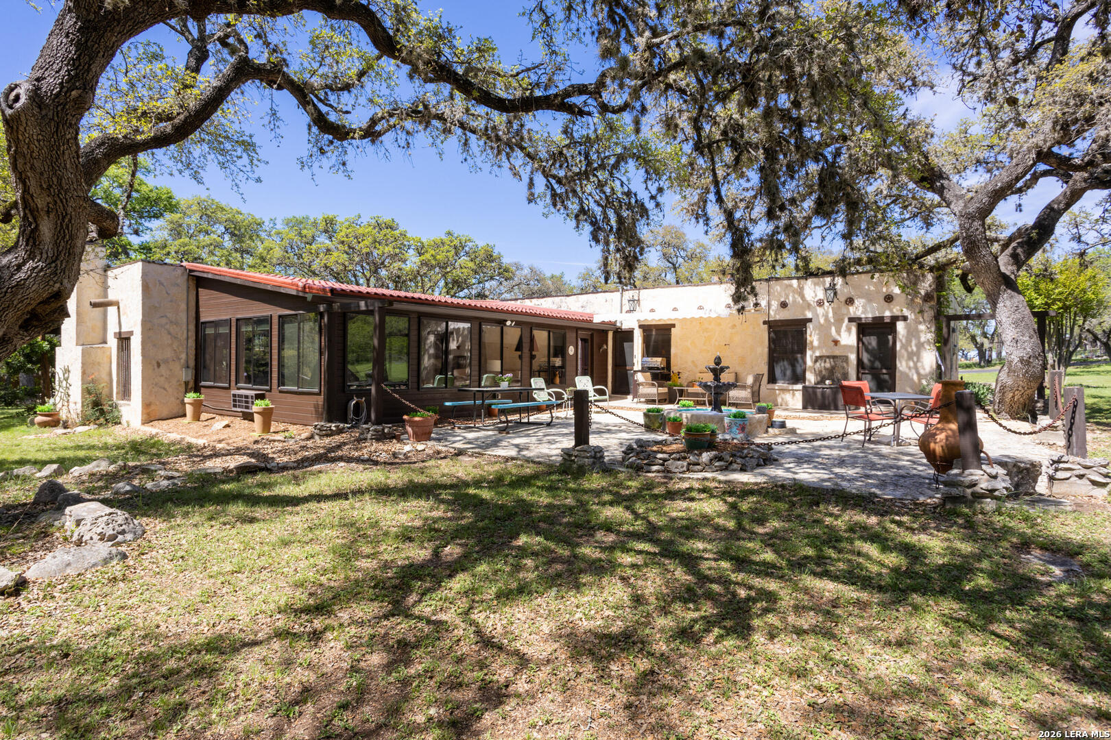 132 Ridge Place Boerne, TX 78006 - Photo 35 of 40 a view of a house with backyard porch and sitting area