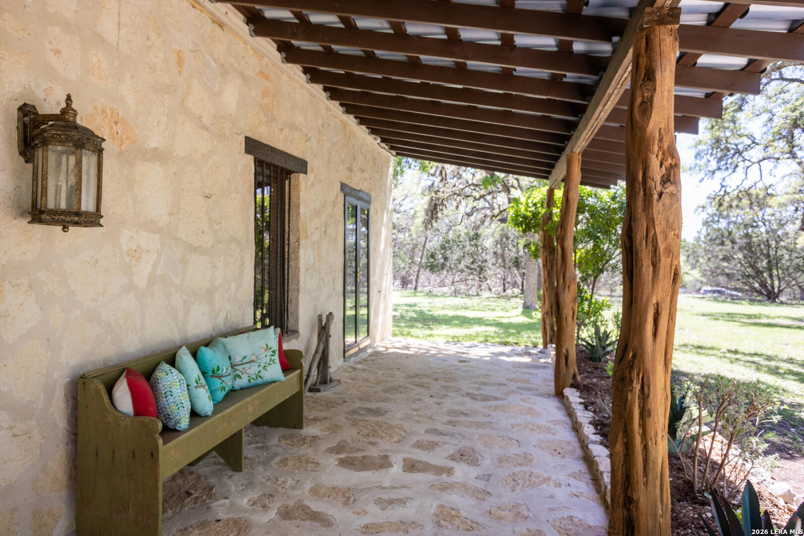 132 Ridge Place Boerne, TX 78006 - Photo 4 of 40 a view of a porch with furniture and garden